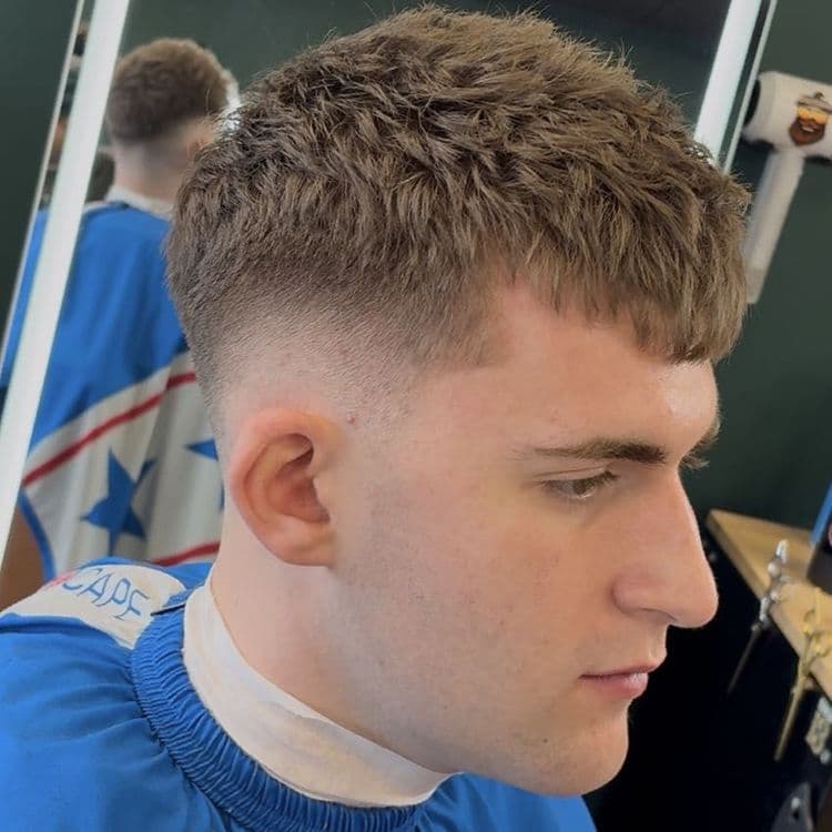 Sharp skin fade by a Shop 13 barber