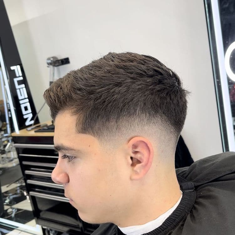 Clean taper haircut at Shop 13 Barber Lounge